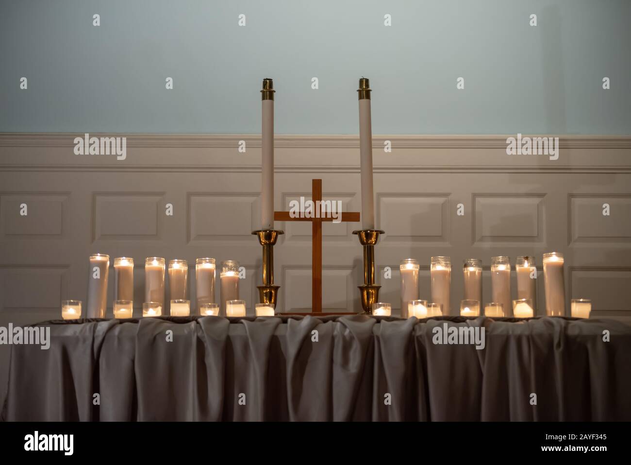 Burning candles on church altar Stock Photo Alamy
