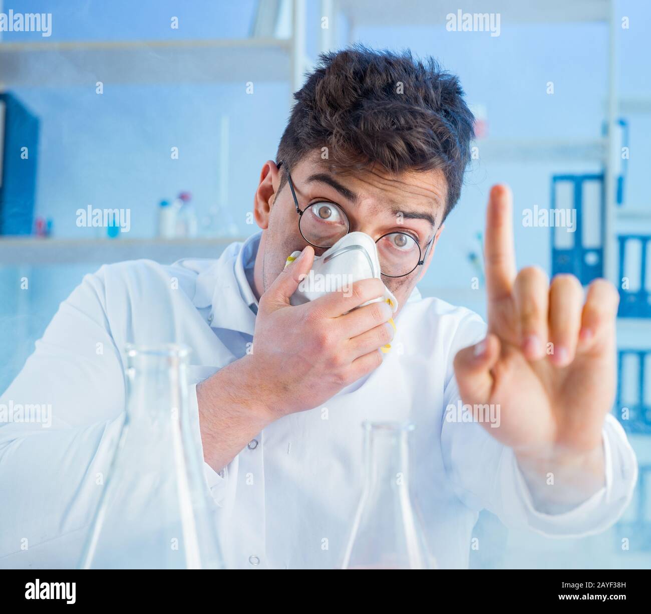 Funny mad chemist working in a laboratory Stock Photo