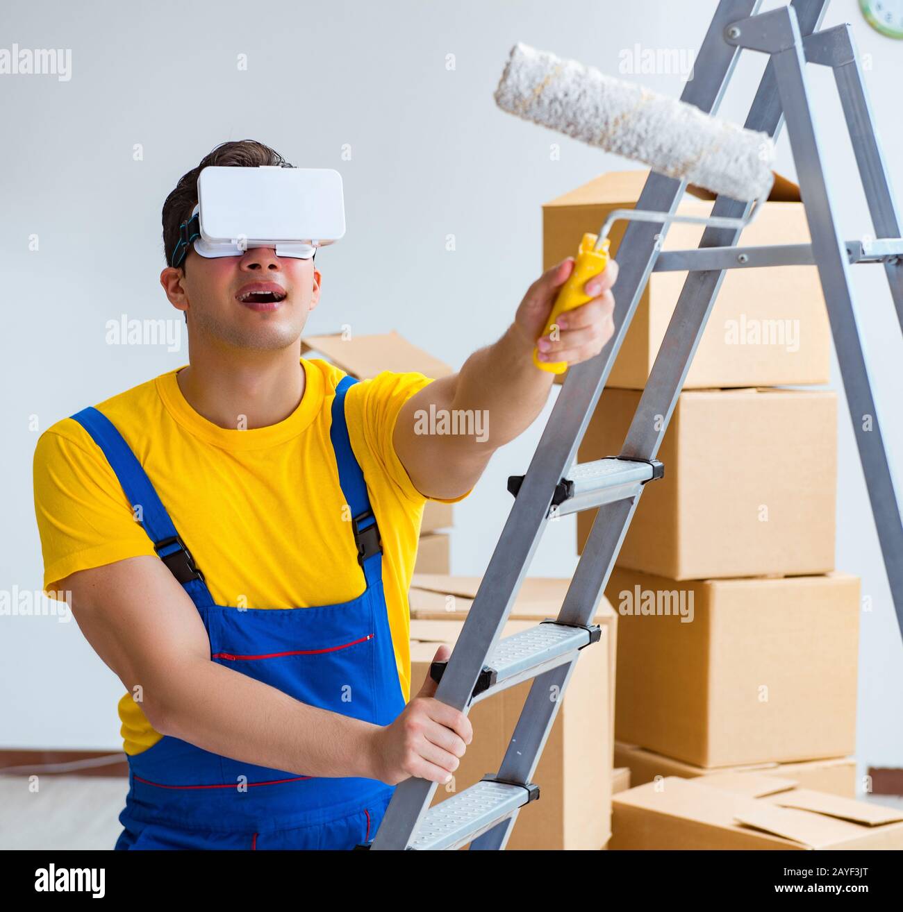 Painter contractor working with virtual reality goggles Stock Photo