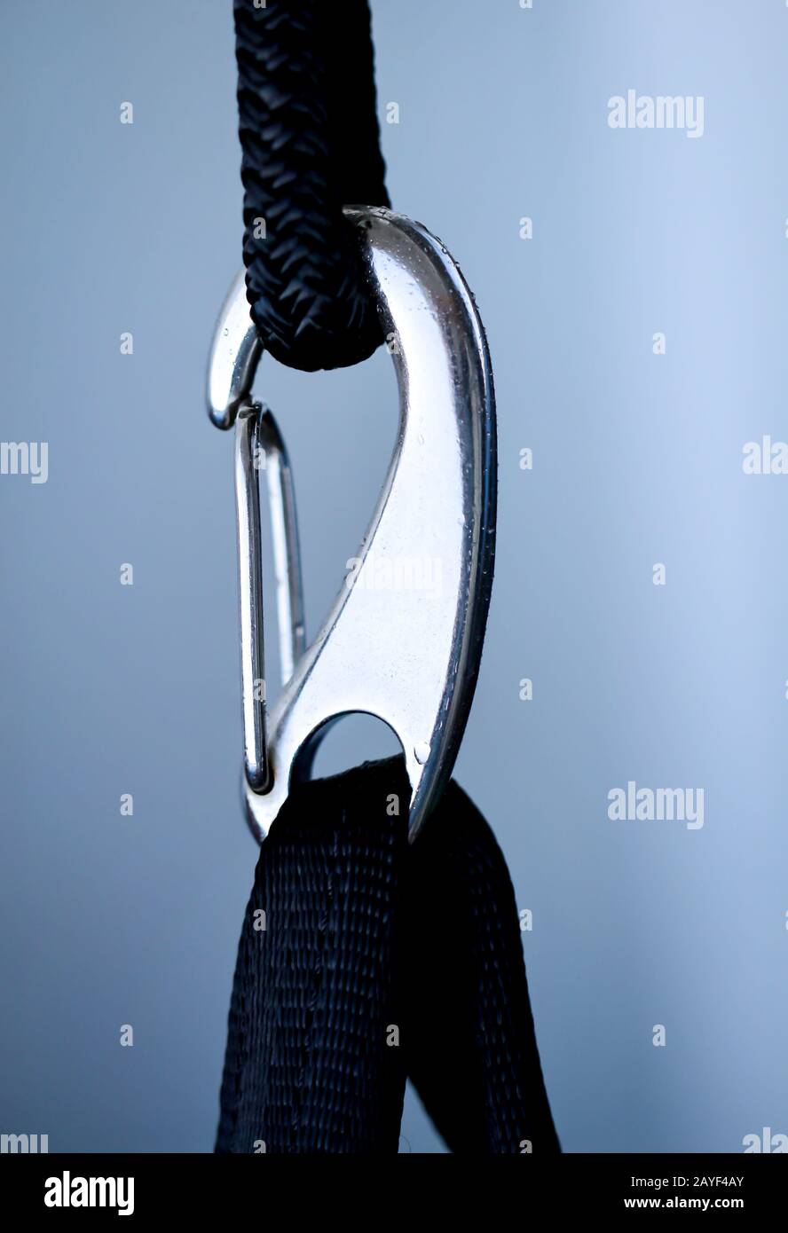 a carabiner is hooked into a loop Stock Photo