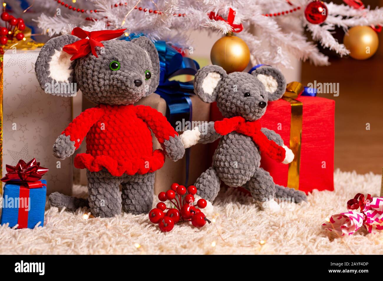 Two funny plush mice under the Christmas tree Stock Photo