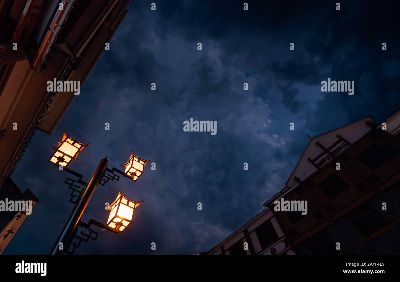 Brightly lit lamppost on the street in Wulingyuan Stock Photo