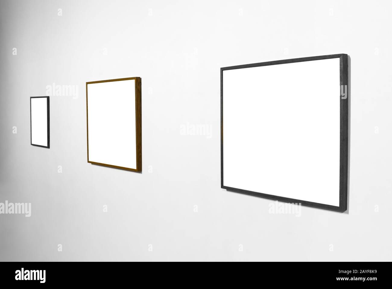Empty picture frame on white wall Stock Photo