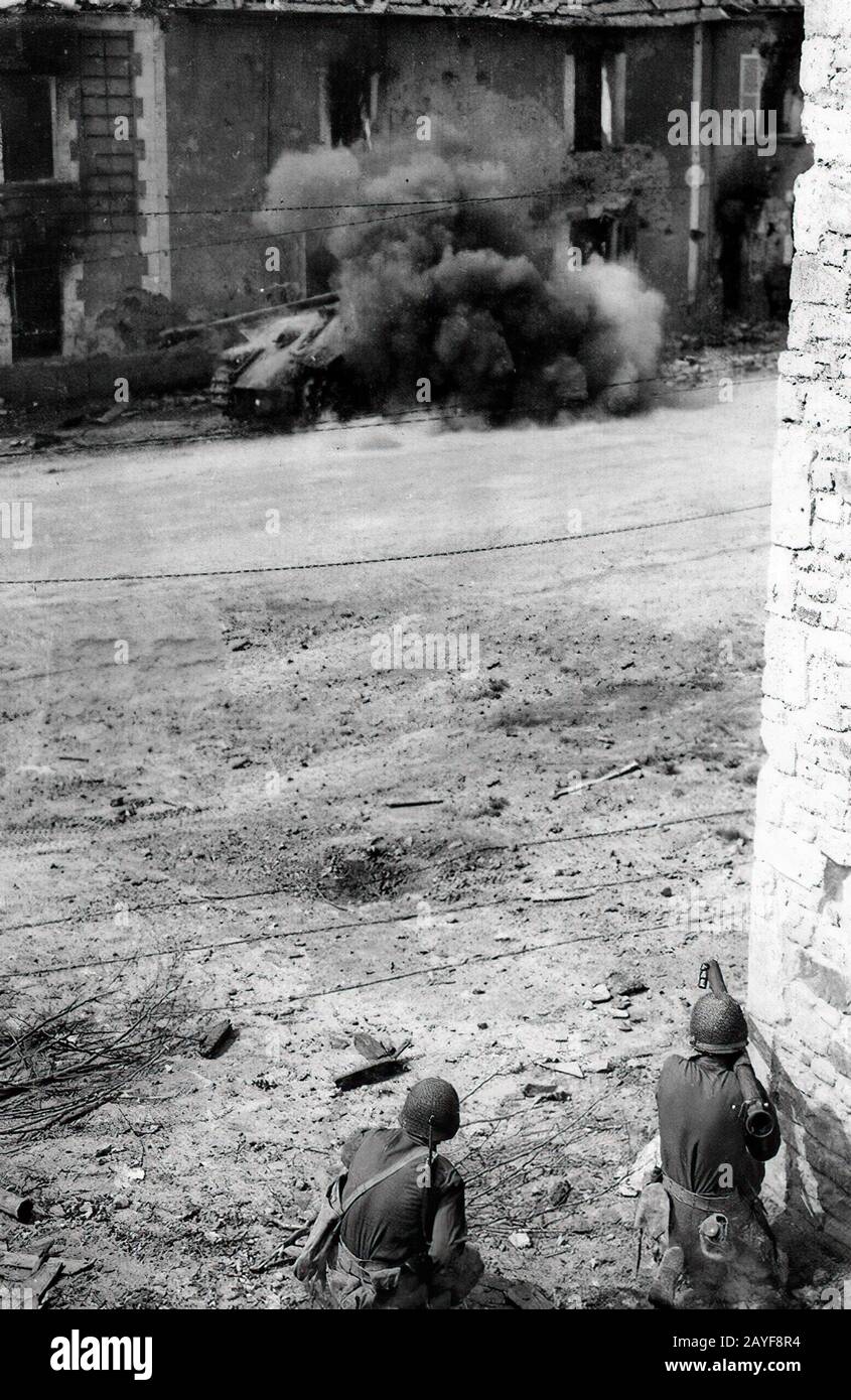 US soldier fires a bazooka at German tank Normandy 1944 Stock Photo