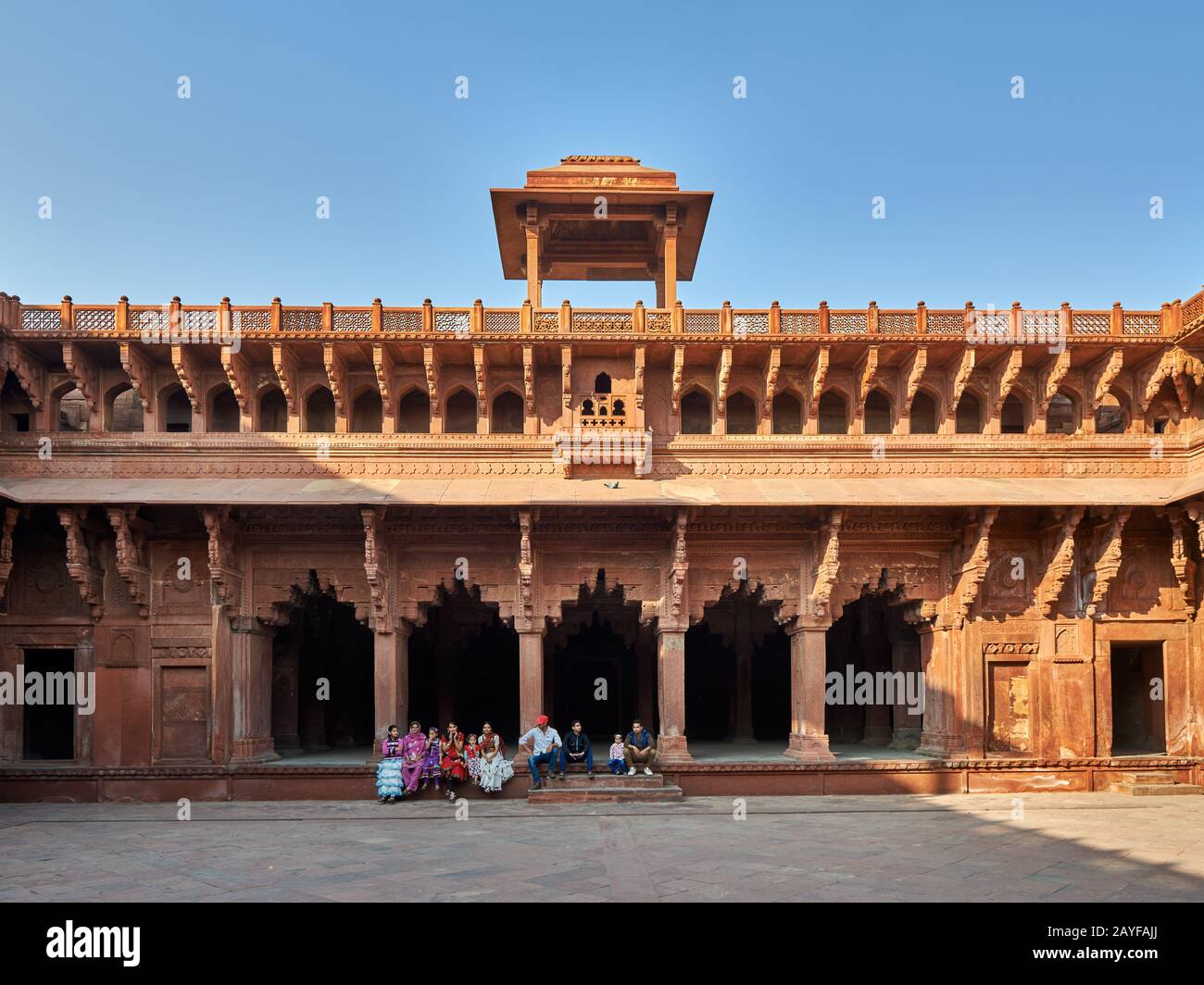 Group of traditionally dressed women and girls inside Agra Fort, Agra, Uttar Pradesh, India Stock Photo