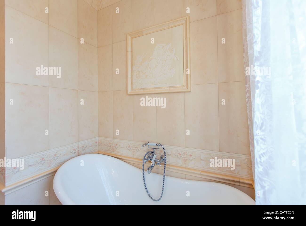 Classic Bathroom In Beige Tones Curved Bath Tub Large Beige Tile White Tiles On The Floor Twisted Chandelier Elegant Expensive Plumbing Stock Photo Alamy