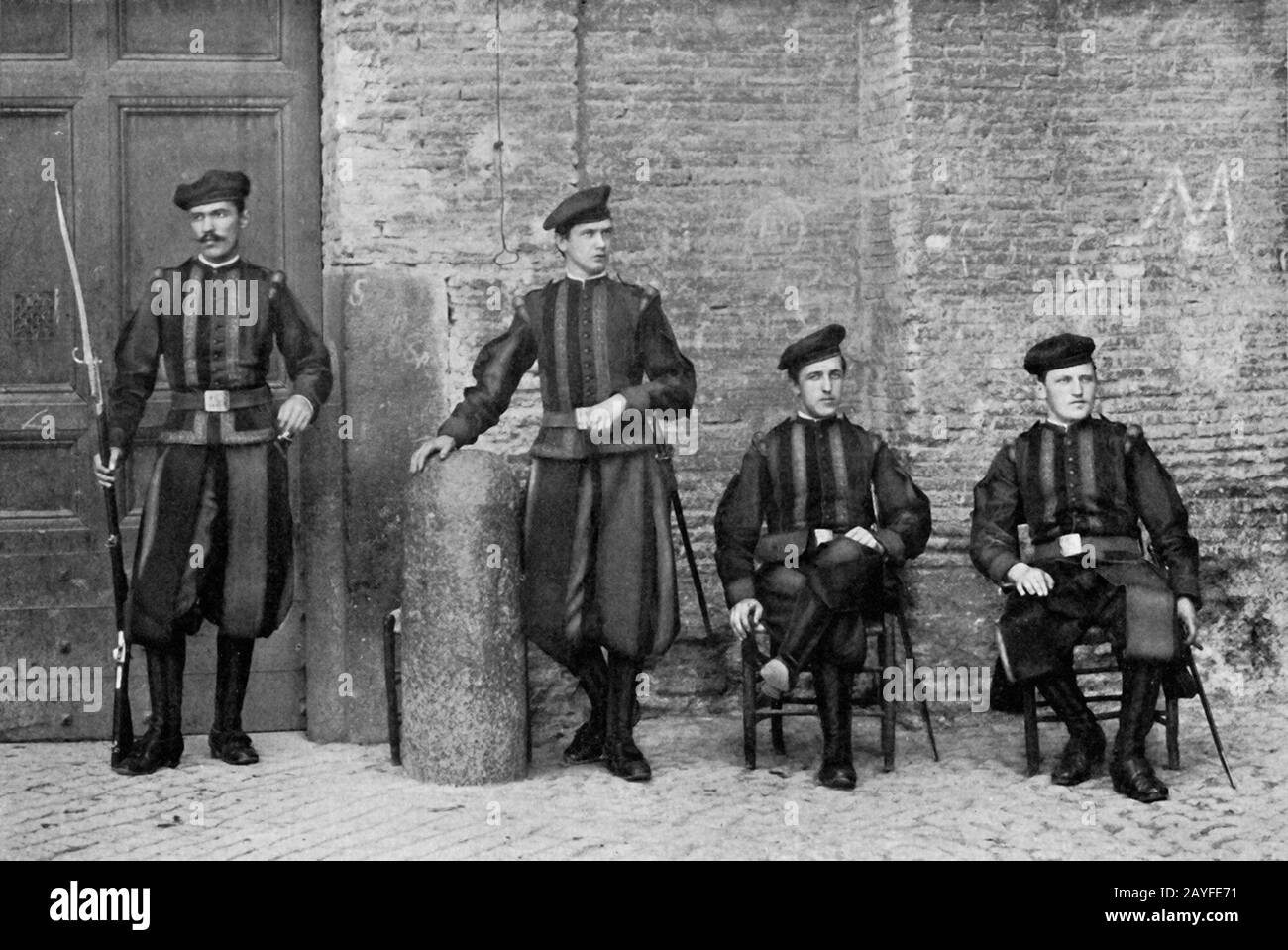 Vintage photo circa late 1915 showing the Vatican Swiss Guard to the Pontifical Holy See stationed at the Vatican. The Papal Swiss Guard are bodyguards within the Vatican. Recruits to the guards must be Catholic, single Swiss citizens and have basic training with the Swiss Armed Forces. Stock Photo