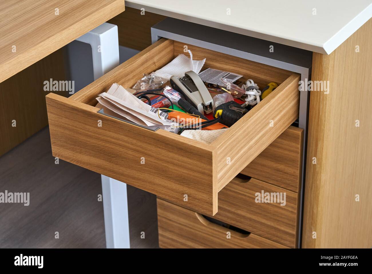 Premium Photo  Woman hand pull open drawer wooden cabinet.