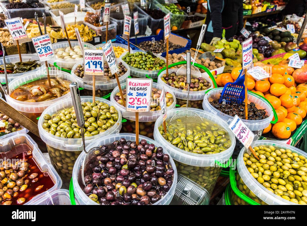 Different varieties of olives in the marketplace in  Granada, Andalusia region, Spain. Stock Photo