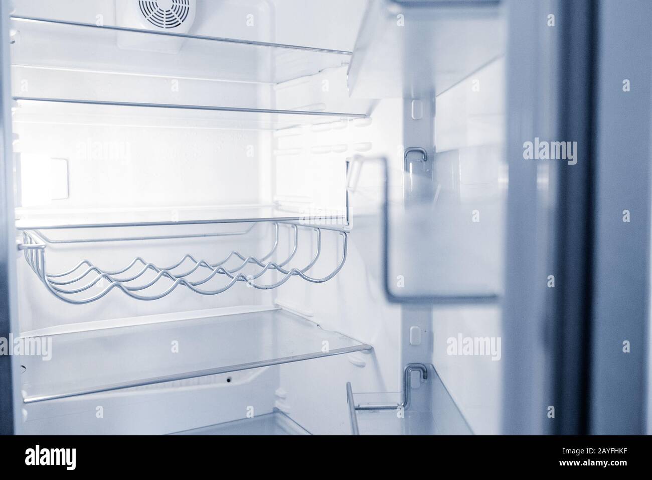 Empty open fridge with shelves in the kitchen at night Stock Photo - Alamy, image size:1300x956