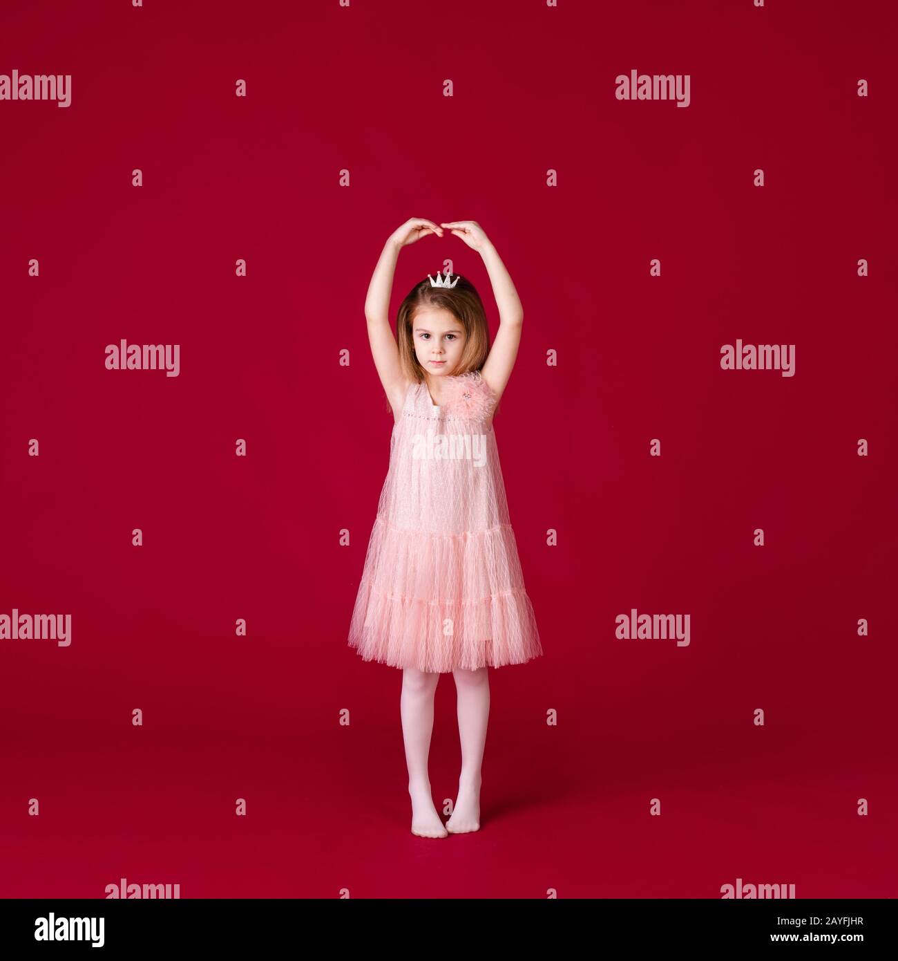 Beautiful little girl princess dancing in luxury pink and silver dress ...