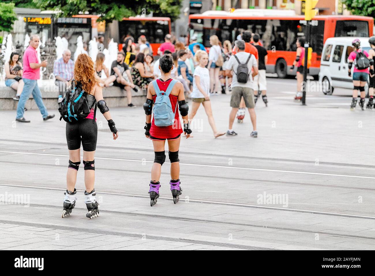 13 JULY 2018, ZARAGOZA, SPAIN Two girls roller skating dangerous ride