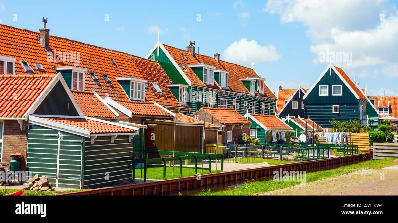 View of the Marken town centre with backyards of traditional wooden houses at the Rietland street on a sunny afternoon. North Holland, The Netherlands Stock Photo