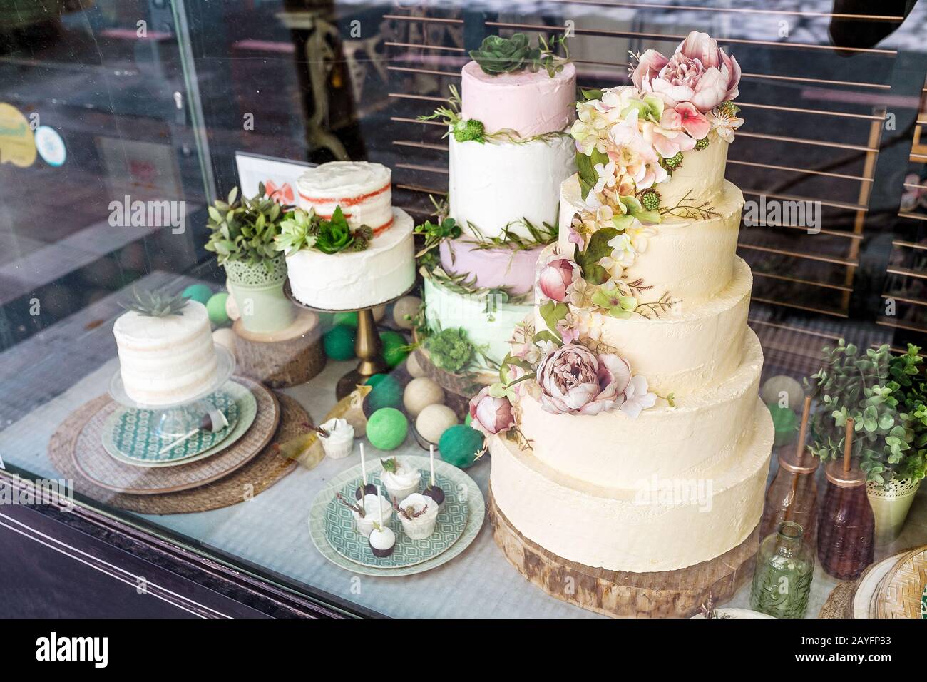 Delicious wedding cake for sale at showcase window Stock Photo Alamy