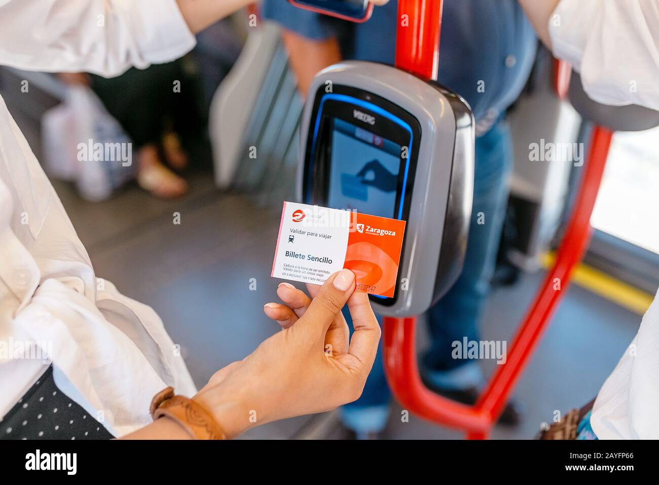 Woman validating public transport hi-res stock photography and images ...