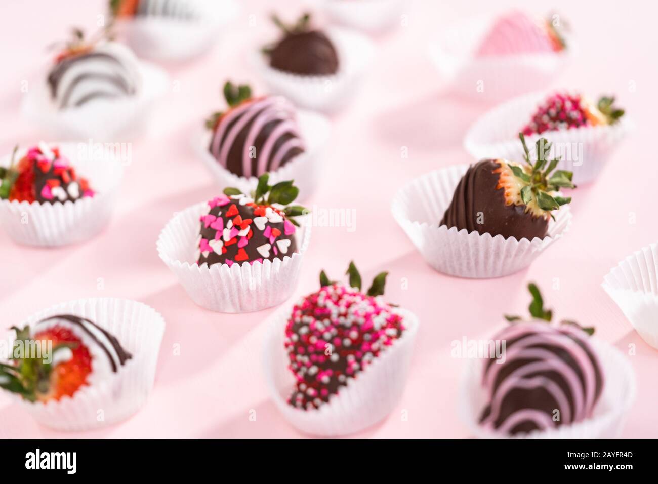 Variety of chocolate dipped strawberries on a pink background Stock ...