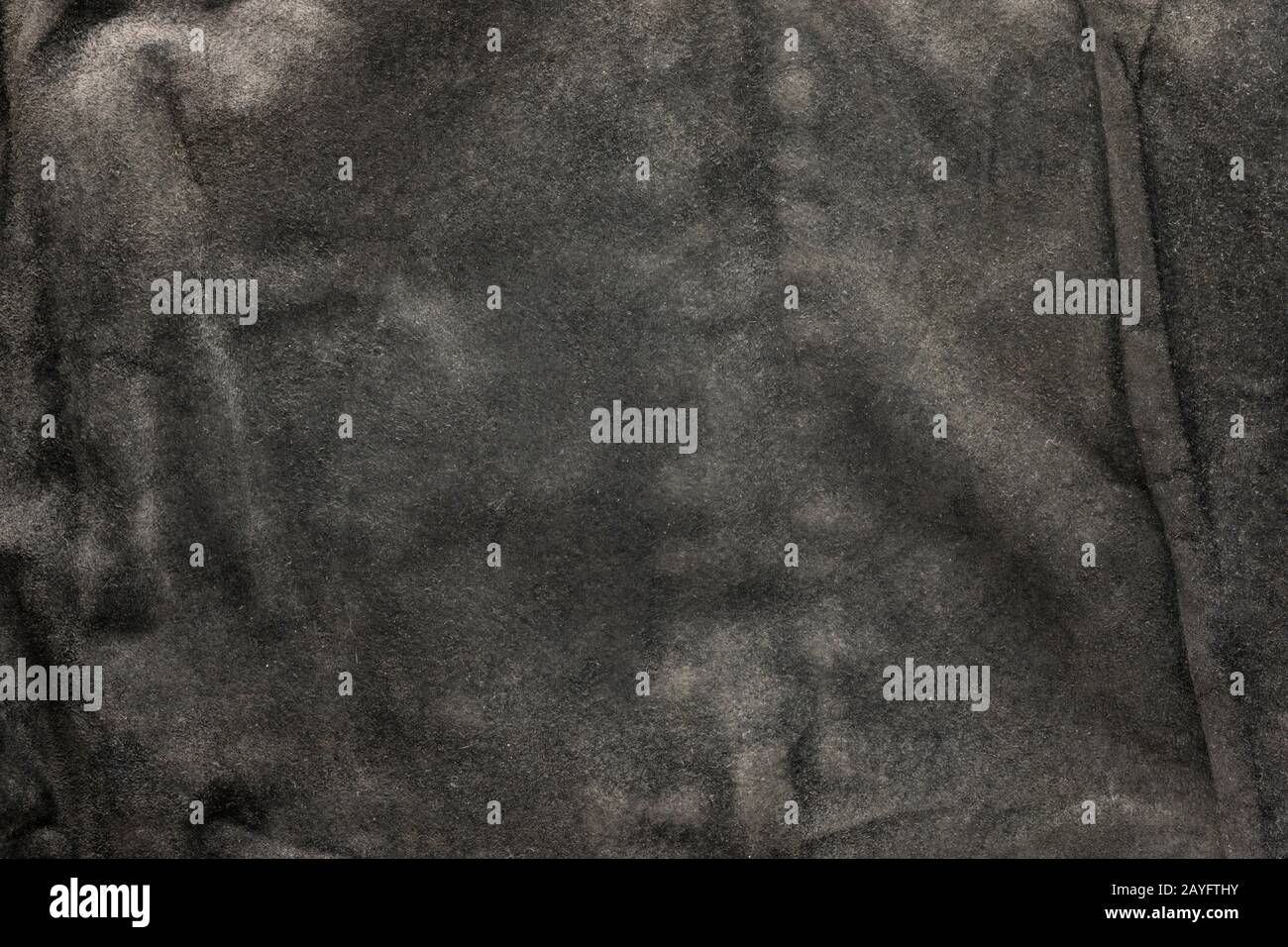 black structural background - old shabby stylish suede, reverse side, old fabric, textile. Stock Photo