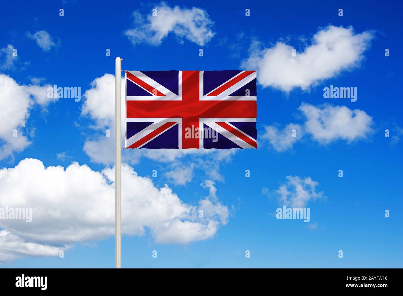 flag of United Kingdom in front of blue cloudy sky, United Kingdom Stock Photo