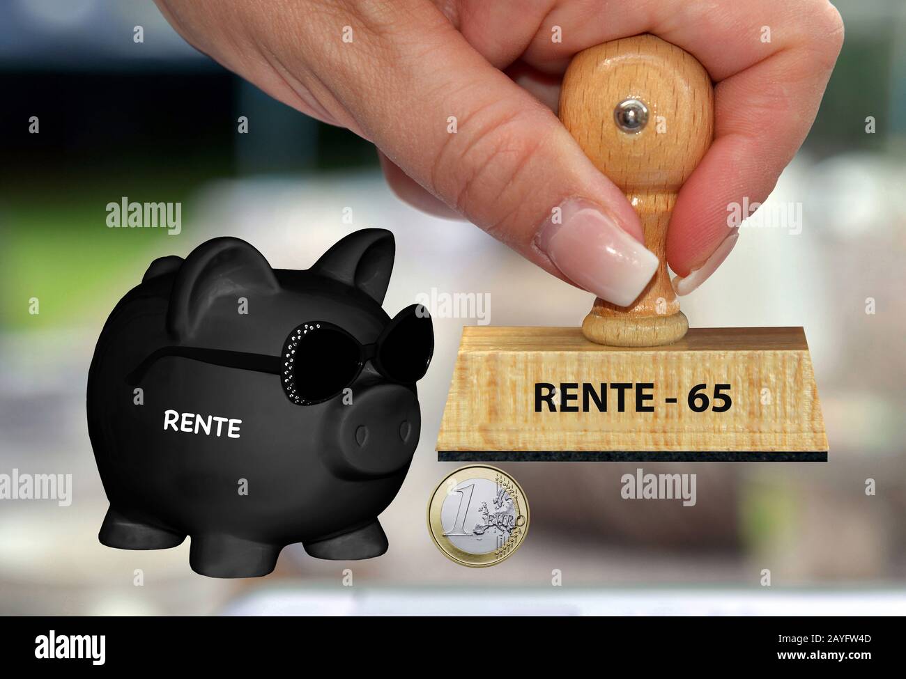 black piggy bank with sunglasses and lettering Rente, pension, stamp 'pension - 65' in background, composing Stock Photo