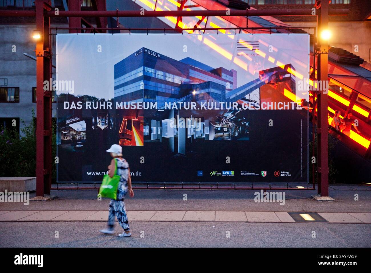 poster of the RuhrMuseum in front of the Gangway of coalmine Zollverein in the evening, Germany, North Rhine-Westphalia, Ruhr Area, Essen Stock Photo