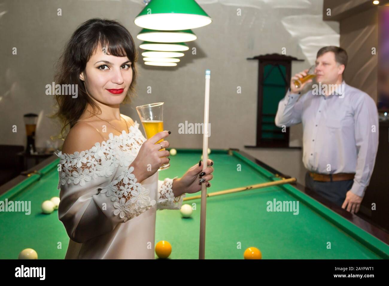 Adult people lovers play billiards
