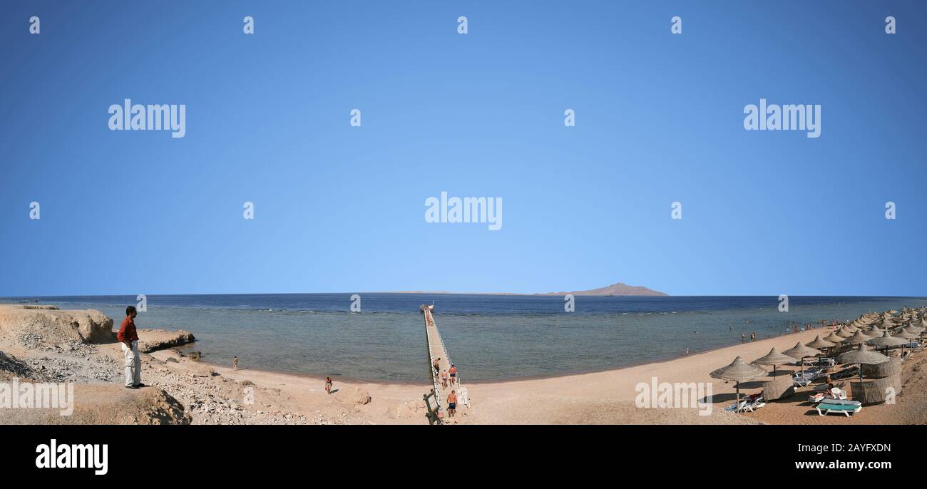 Sharm el Sheikh, Egypt.  June 24, 2010 panorama of the beach in Egypt with a view of the pier and the island of Tiran. People relax on vacation Stock Photo