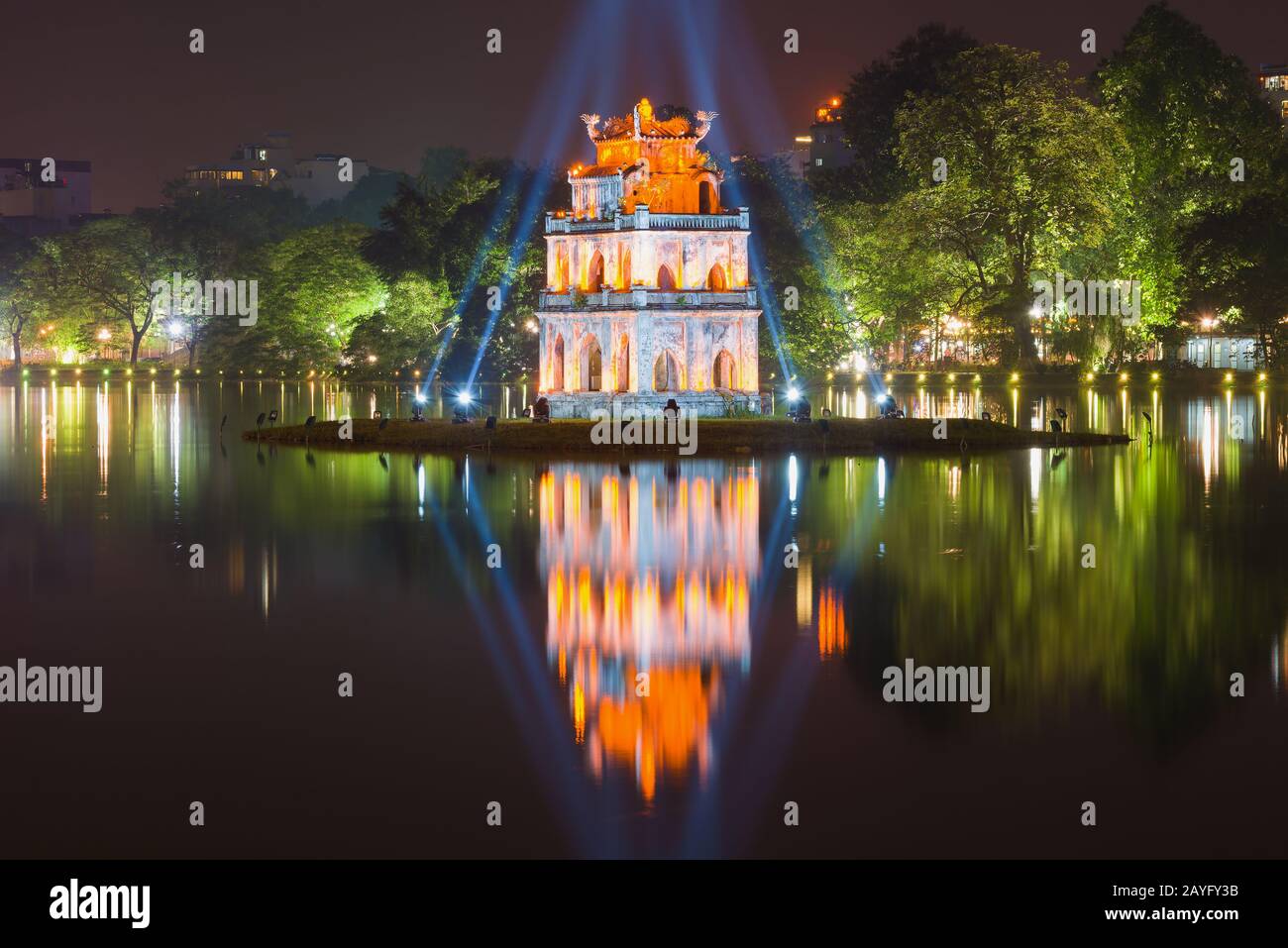 The ancient Turtle Tower in the rays of the floodlights on Hoan Kiem Lake in the late evening. Hanoi, Vietnam Stock Photo