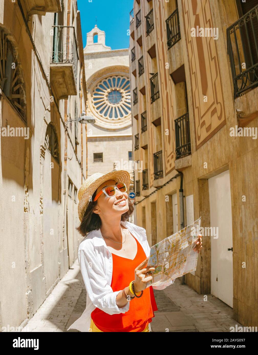 Happy tourist with map in Reus, Spain Stock Photo