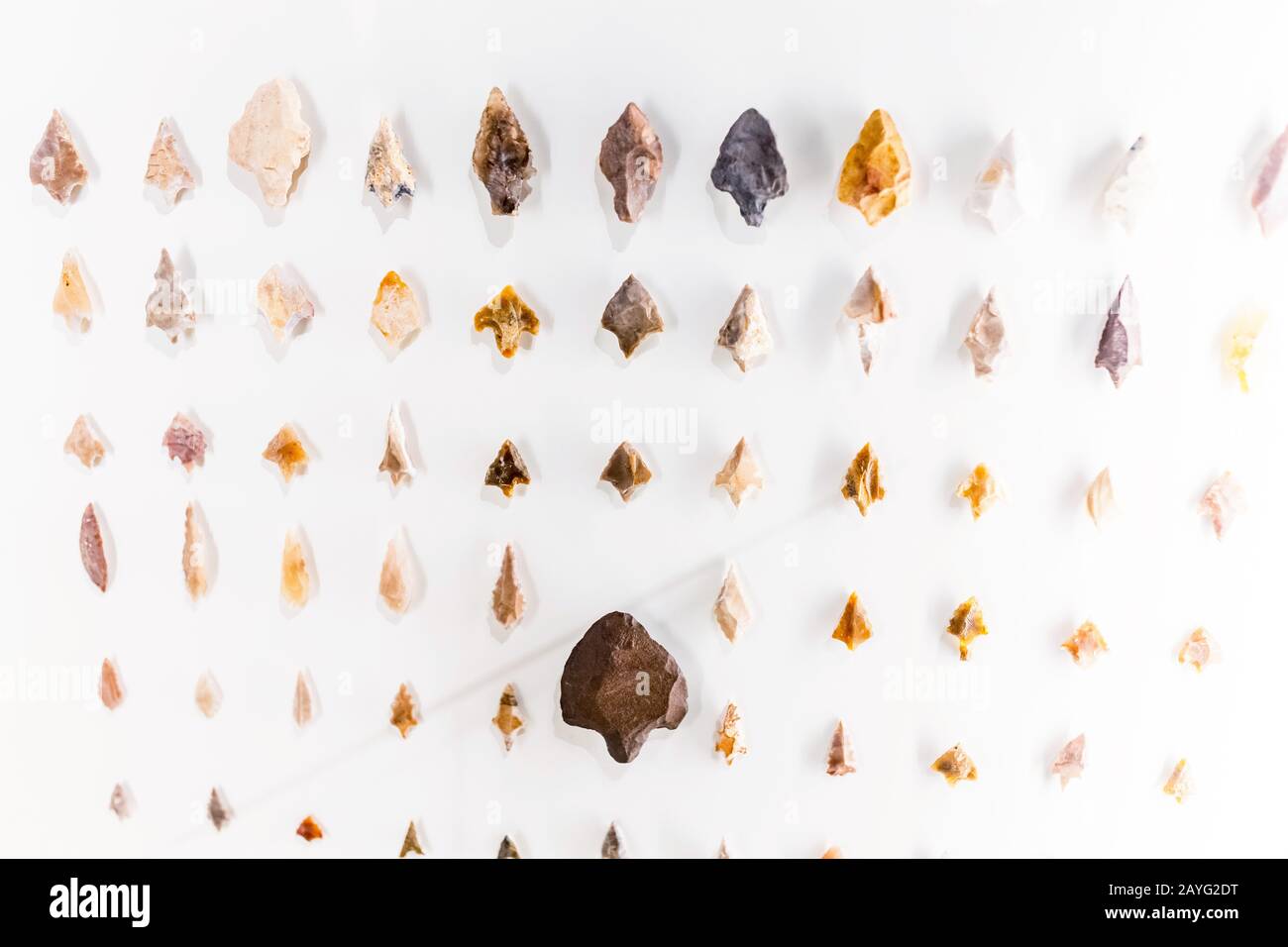 Stone arrowheads as primitive weapon and tools, archeology concept Stock Photo