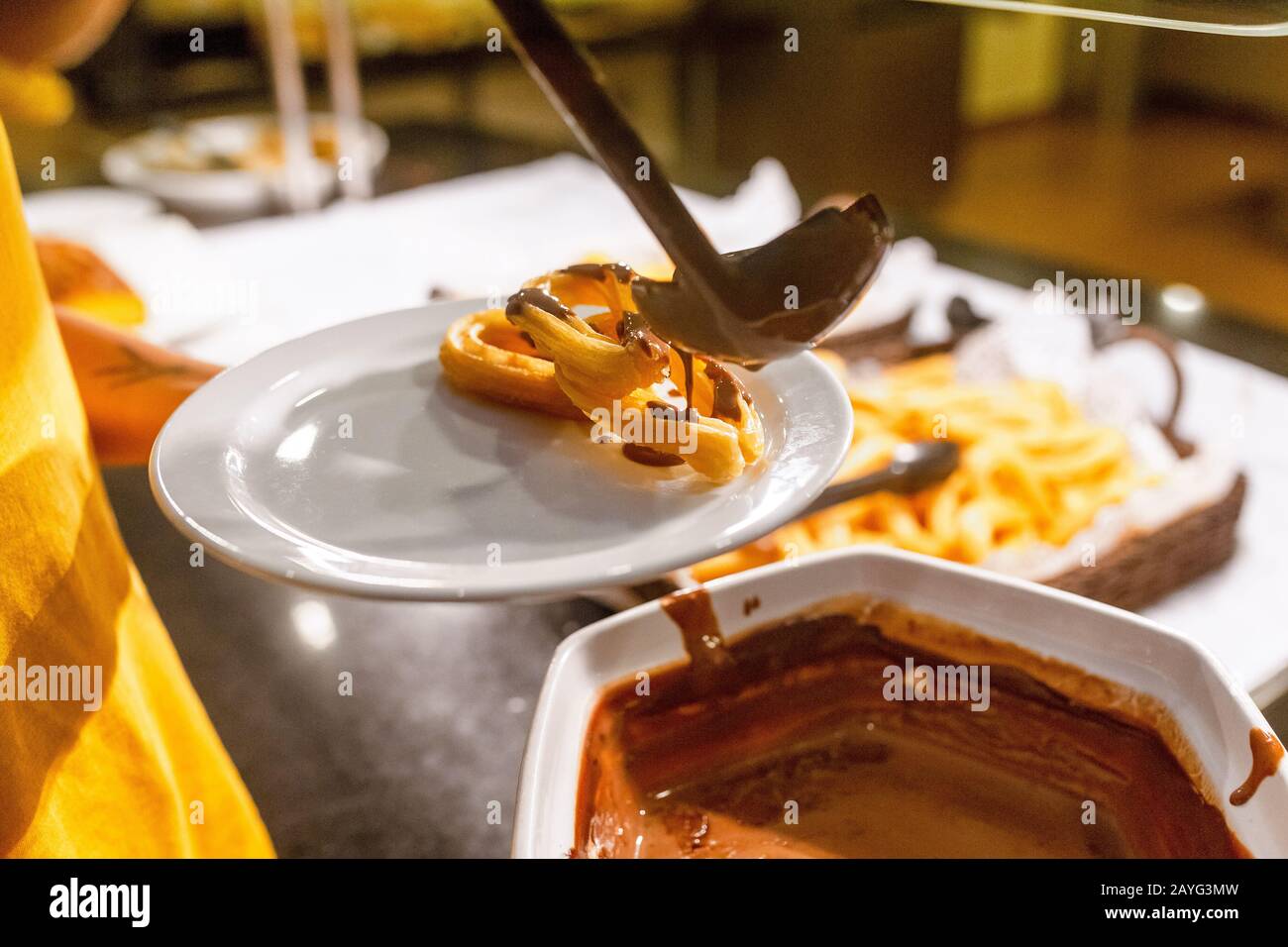 Churros with sugar and chocolate, famous spanish dessert Stock Photo