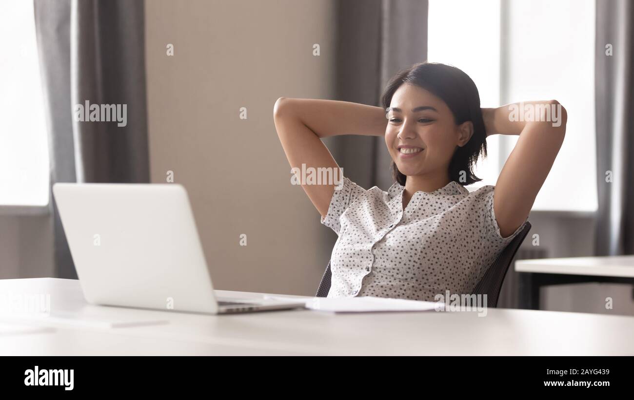 Woman leaning back in chair hi-res stock photography and images - Alamy