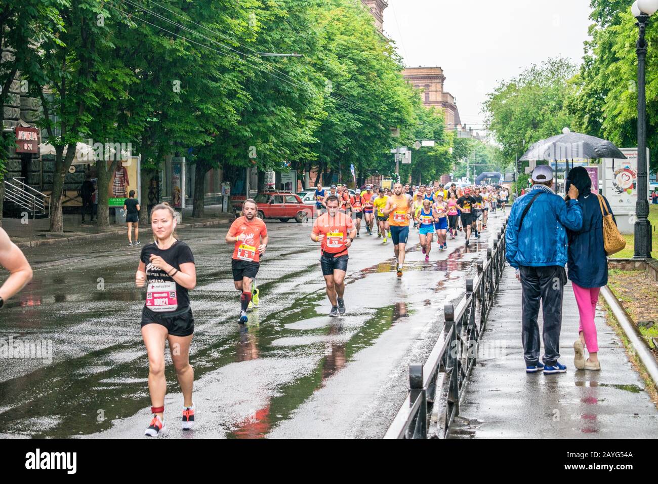 Dnepr, Ukraine - May 20, 2018: Athletes run a marathon through the streets of the city. Promoting a healthy lifestyle. Stock Photo