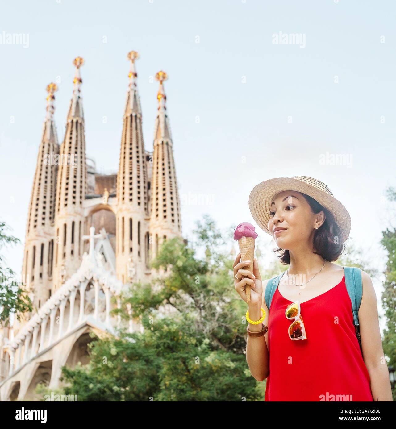 29 JULY 2018, BARCELONA, SPAIN: Young woman tourist in front of the famous Sagrada Familia landmark in Barcelona Stock Photo