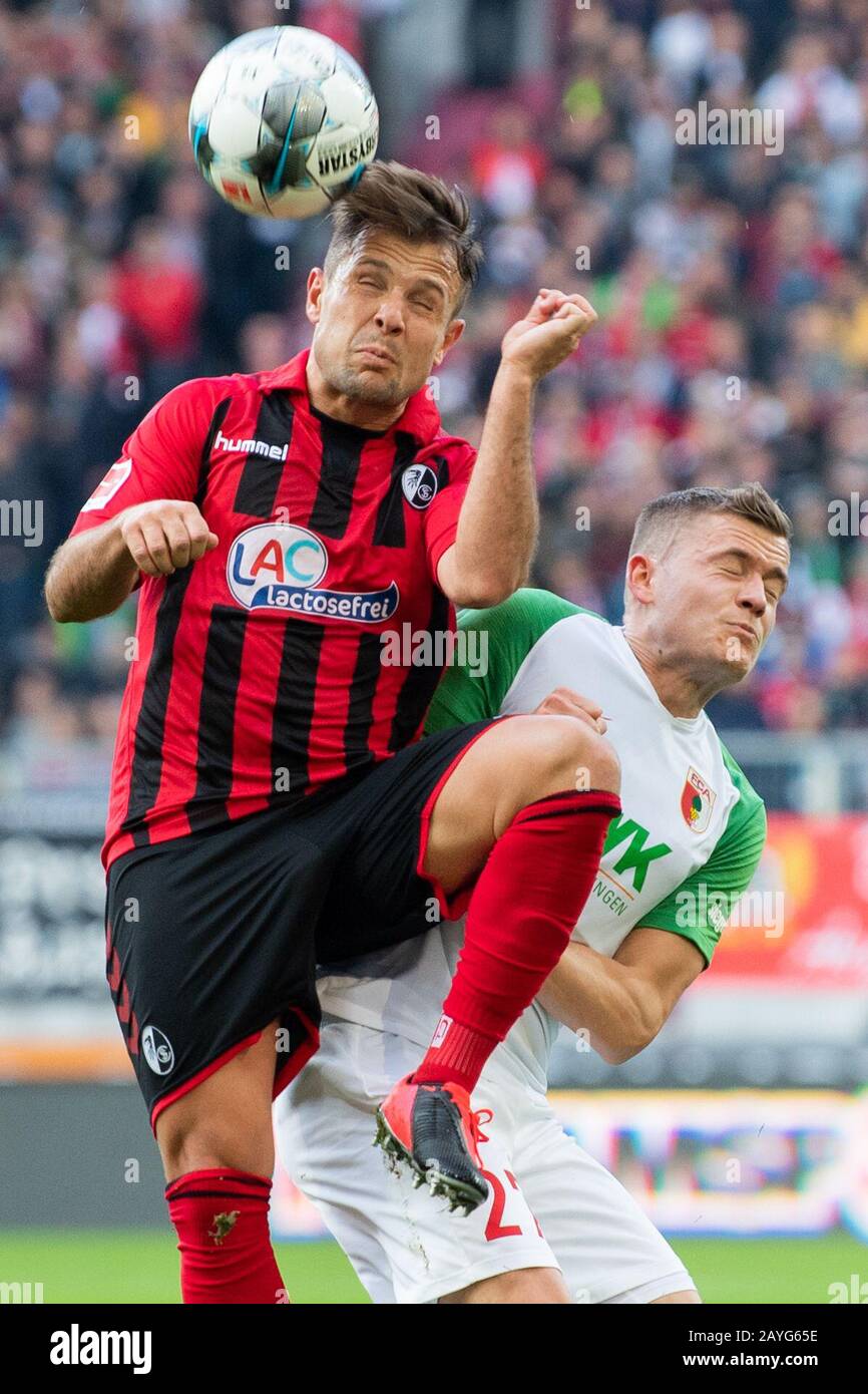 Duesseldorf, Germany. Paderborn, Deutschland. 15th Feb, 2020. Augsburg, Germany. 15th Feb, 2020. Football: Bundesliga, 22nd matchday, FC Augsburg - SC Freiburg, WWK Arena. Freiburg's Amir Abrashi (l) in action against Augsburg's Alfred Finnbogason. Credit: Tom Weller/dpa - IMPORTANT NOTE: In accordance with the regulations of the DFL Deutsche Fußball Liga and the DFB Deutscher Fußball-Bund, it is prohibited to exploit or have exploited in the stadium and/or from the game taken photographs in the form of sequence images and/or video-like photo series./dpa/Alamy Live News Credit: dpa picture all Stock Photo