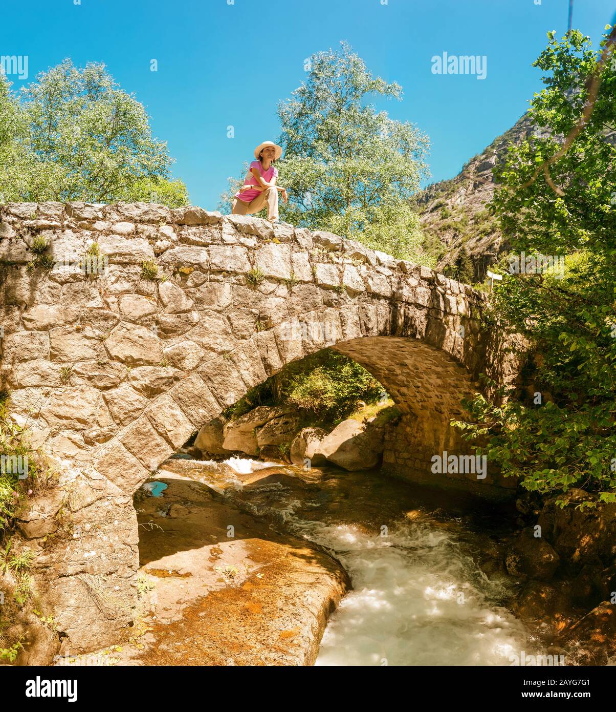 Woman old stone bridge hi-res stock photography and images - Alamy
