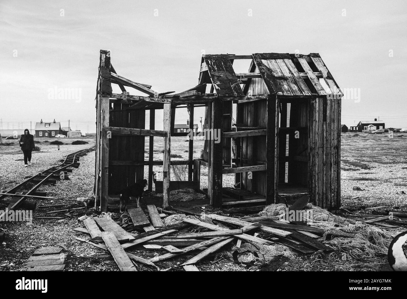 Black and white photo of a dilapidated building on Dungeness beach Stock Photo