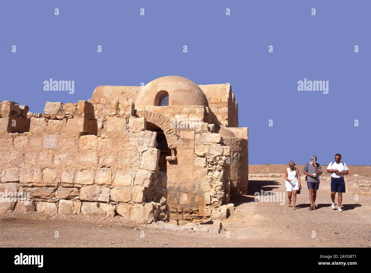 Qusayr Amra, Jordan-August 16,2001: Tourists at Qusayr Amra.This Desert Castle is the best-known of the desert castles located in present-day eastern Stock Photo