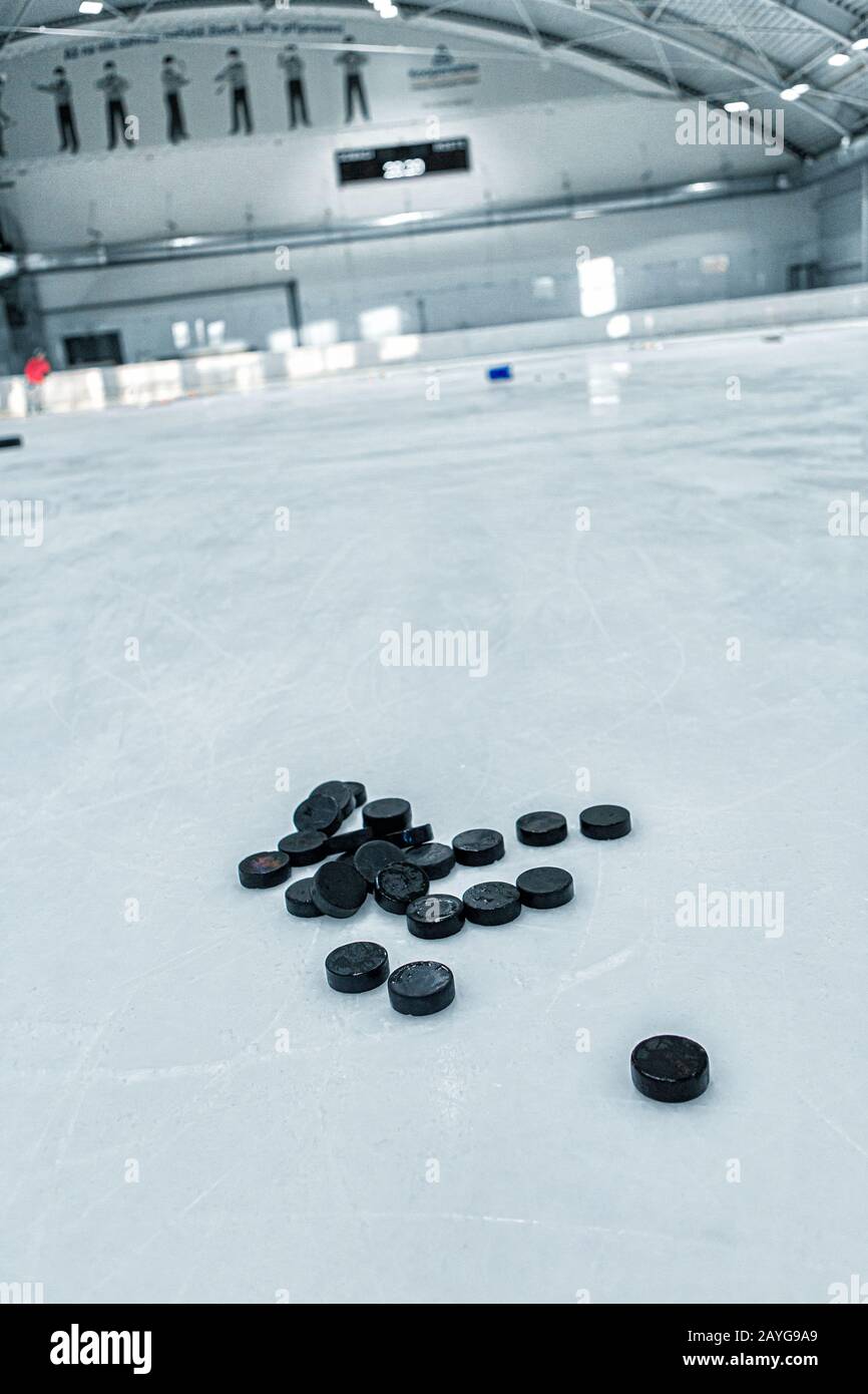 Ice hockey rink background, pucks Stock Photo Alamy