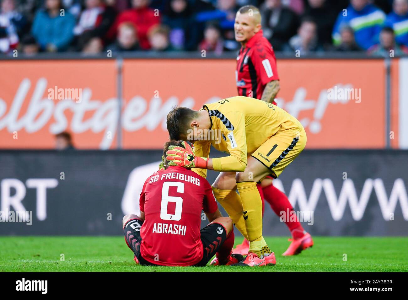 Duesseldorf, Germany. Paderborn, Deutschland. 15th Feb, 2020. Augsburg, Germany. 15th Feb, 2020. Football: Bundesliga, 22nd matchday, FC Augsburg - SC Freiburg, WWK Arena. Freiburg's Amir Abrashi (l) and Freiburg's goalkeeper Alexander Schwolow (r) react after the game. In the background is Freiburg's Jonathan Schmid Credit: Tom Weller/dpa - IMPORTANT NOTE: In accordance with the regulations of the DFL Deutsche Fußball Liga and the DFB Deutscher Fußball-Bund, it is prohibited to exploit or have exploited in the stadium and/or from the game taken photographs in the form of sequence images and/o Stock Photo