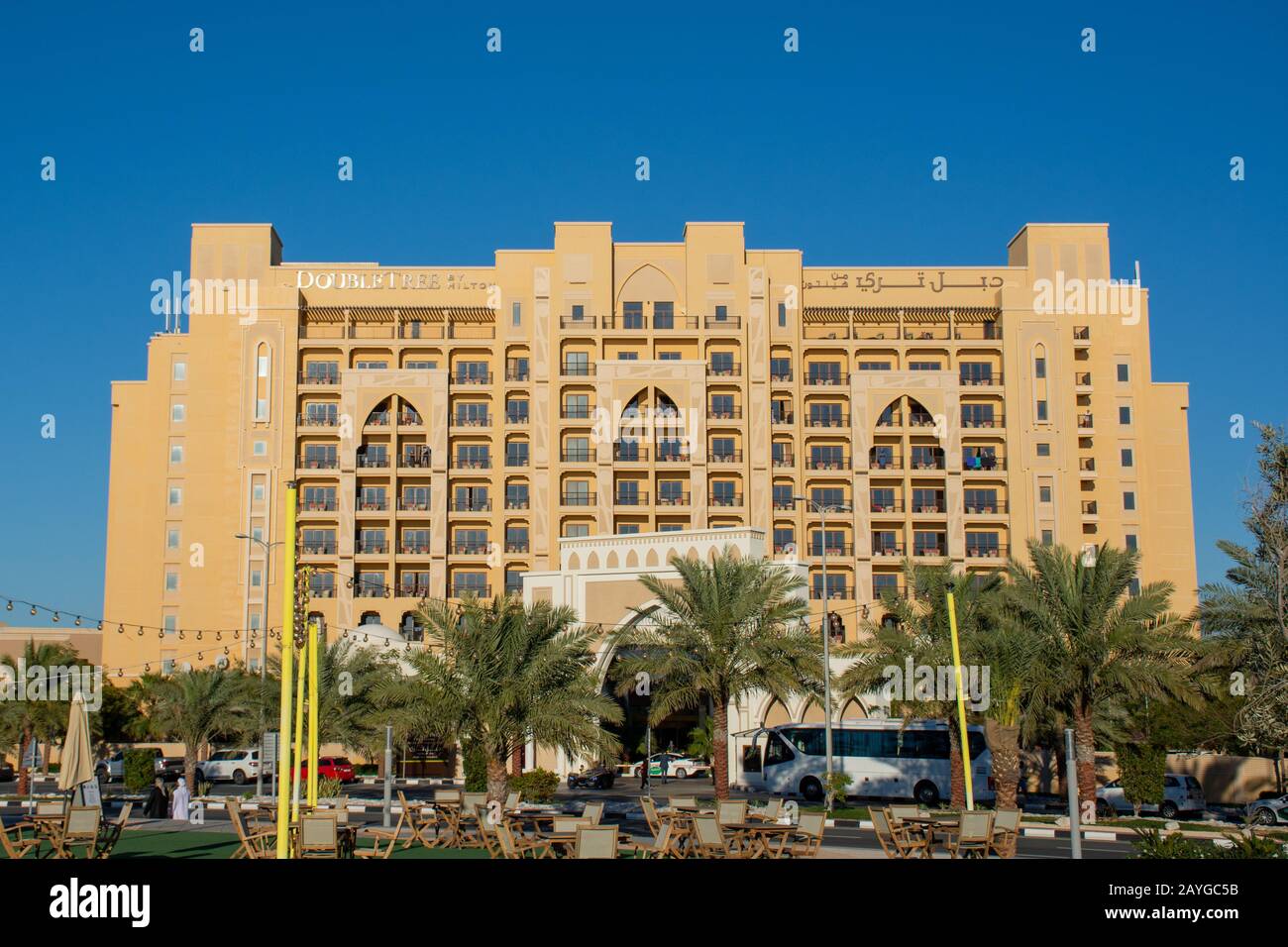 'Ras al Khaimah, Ras al Khaimah/United Arab Emirates - 2/14/2020: 'Hilton Double Tree Hotel building sign against blue sky background Marjan Island at Stock Photo