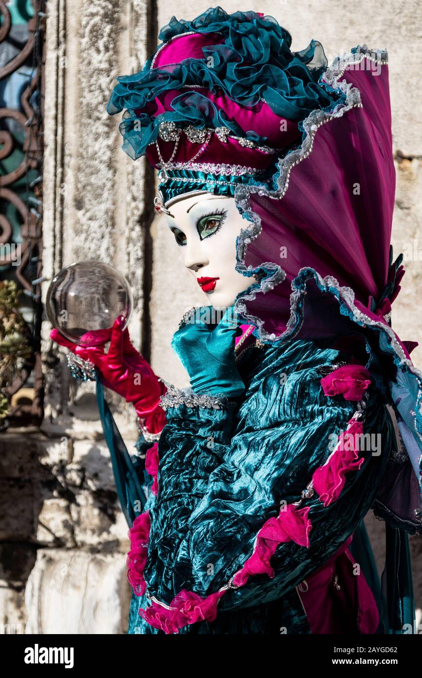 Venice, Italy. 15 February 2020. Woman holding a crystal ball. Carnival in  Venice is in full