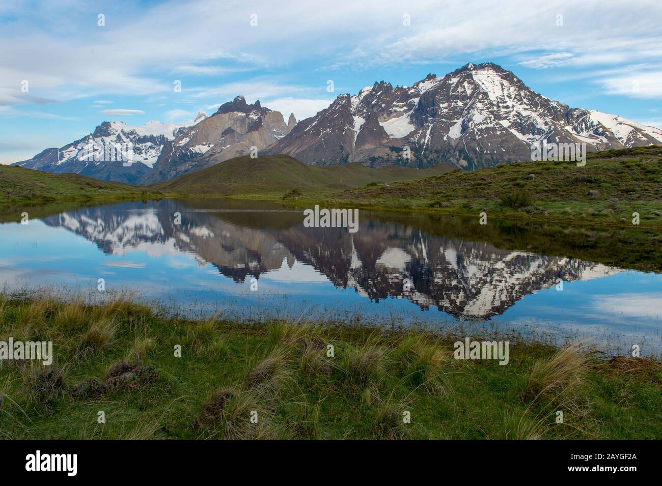 Cuernos del Paine and Almirante Nieto Mountains reflecting in small lake in Torres del Paine National Park in Patagonia, Chile. Stock Photo
