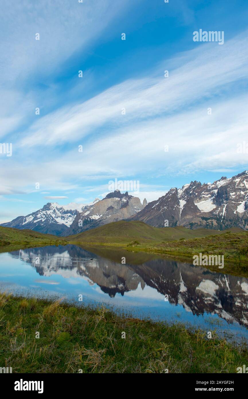 Cuernos del Paine and Almirante Nieto Mountains reflecting in small lake in Torres del Paine National Park in Patagonia, Chile. Stock Photo