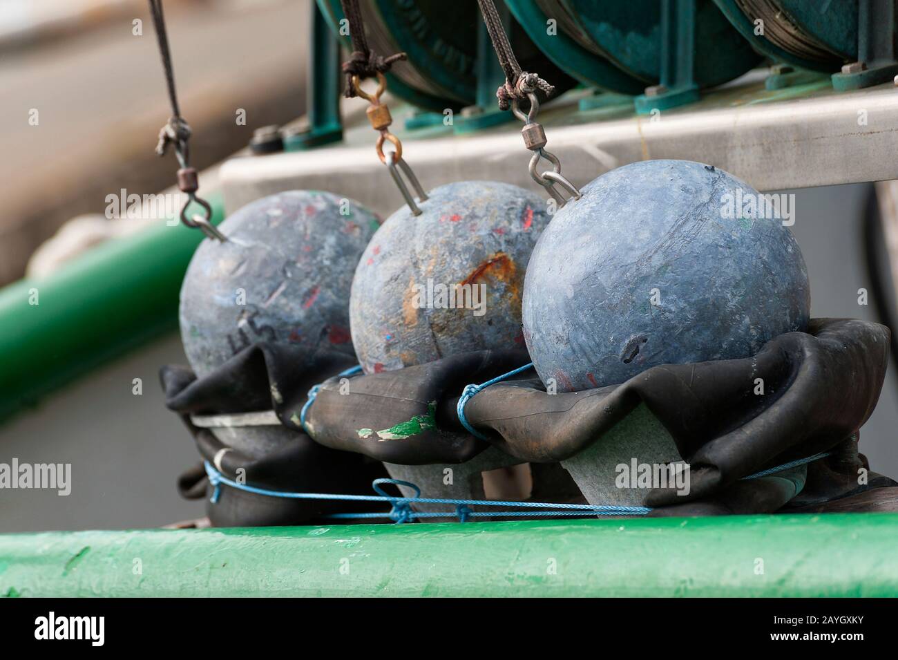 Close up of fishermen's round iron balls used for anchoring nets