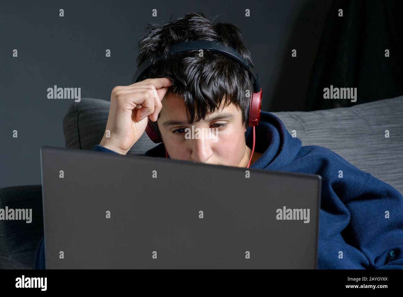 Teenage boy watching computer screen hi-res stock photography and ...