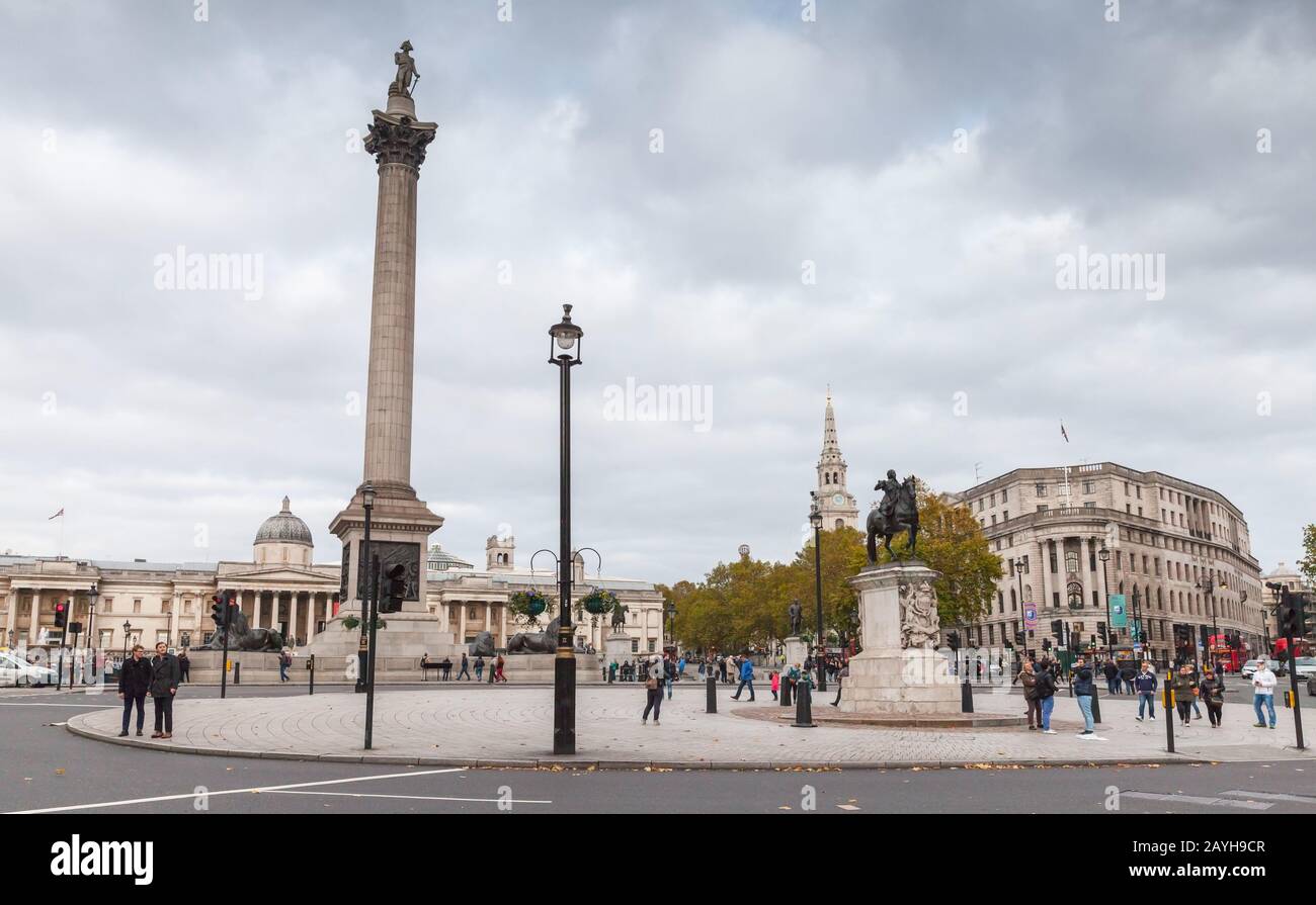 London, United Kingdom - October 29, 2017: Trafalgar Square, tourists walk near the Nelsons Column Stock Photo