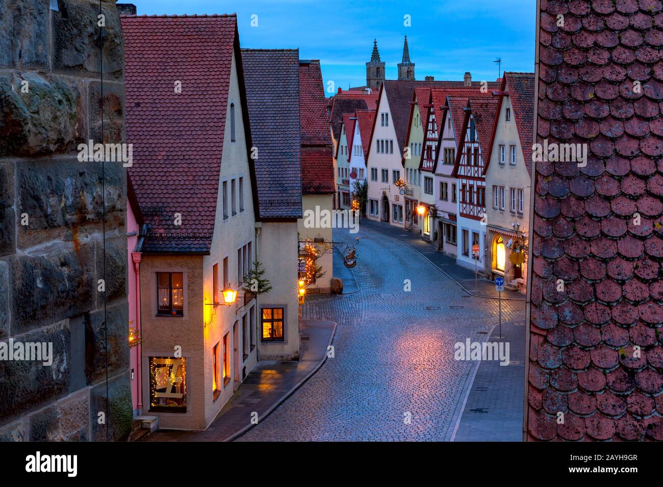 Night aerial view from town wall of roofs, towers in medieval Old Town of Rothenburg ob der Tauber, Bavaria, southern Germany Stock Photo