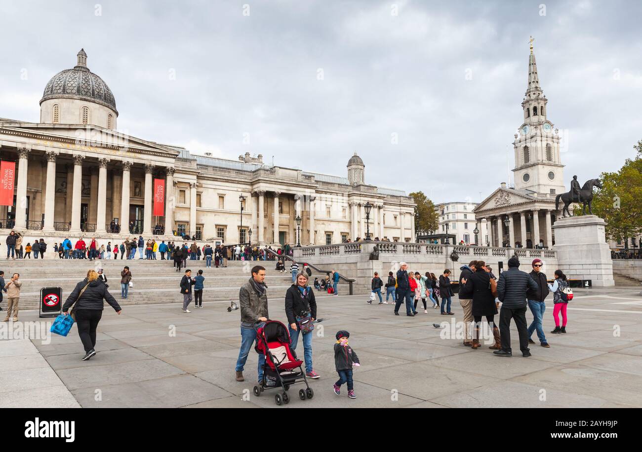 London, United Kingdom - October 29, 2017: Trafalgar Square, people walk near the National Gallery Stock Photo