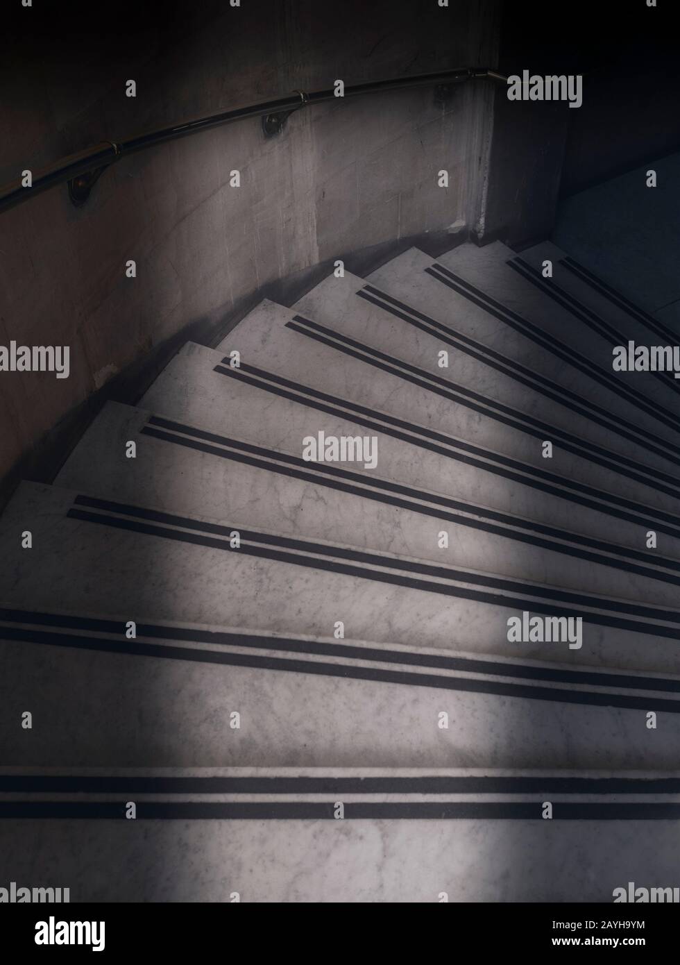 Light shining down marble staircase Stock Photo Alamy