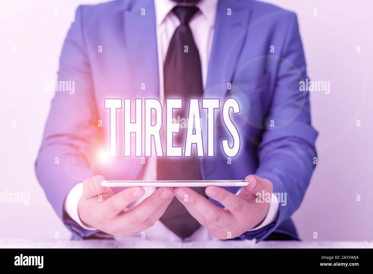 Word writing text Threats. Business photo showcasing Statement of an intention to inflict pain hostile action on someone Businessman in blue suite wit Stock Photo
